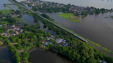 Train rides near river countryside (Aerial View) Stock Footage 283245953