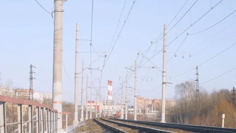 Train rides on rails, blue sky and communications Stock Footage 124494326