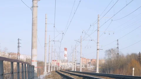 Train rides on rails, blue sky and communications Stock Footage 124494463