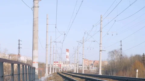 Train rides on rails, blue sky and communications Stock Footage 124494942