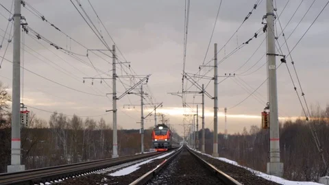 Train rides on rails, sunset sky in the background Stock Footage 124744121