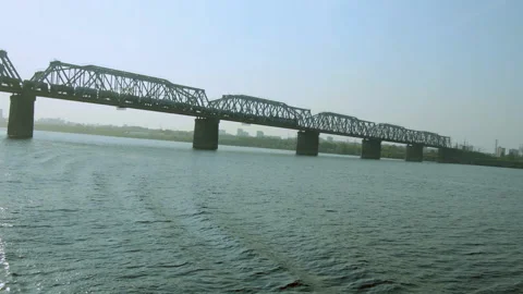 Train rides on a railway bridge. Stock Footage 142771583