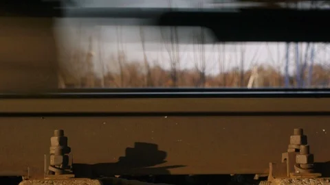 Train rides on shock absorbing rails, close-up Stock Footage 124504445