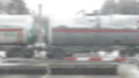 The train rides through the forest. Defocus Vídeos de archivo 100822054