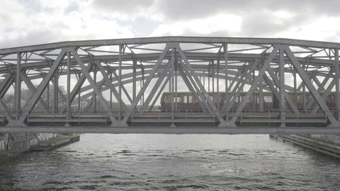 Train Riding over Berlin bridge in sunny light 4k slow motion Stock Footage 122938299