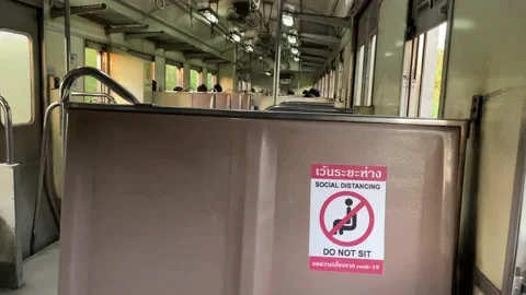Train riding "Social distancing, Do not sit" sticker sign on seat old fan train Video stock 196240667