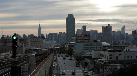 Train rolls into station with city skyline in background 1 Stock Footage 40521189
