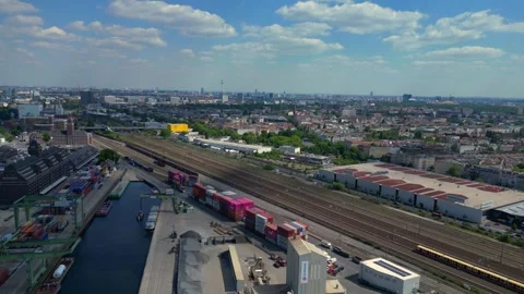 Train run at city industrial container port. Amazing aerial view flight drone Stock Footage 311423527