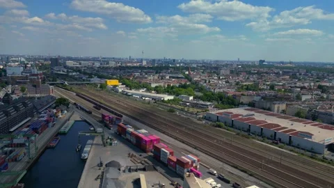 Train run at city industrial containers port. Best aerial view flight drone Stock Footage 310172287