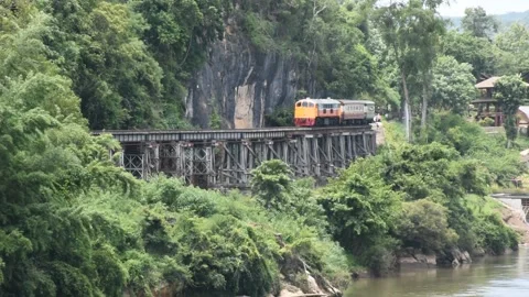 Train run on track at hellfire pass mountain station in Kanchanaburi, Thailand Stock Footage 156589216