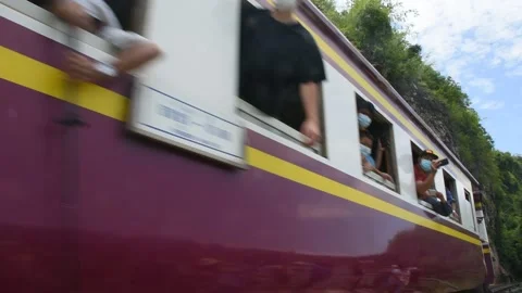 Train run on track at hellfire pass mountain station in Kanchanaburi, Thailand Stock Footage 156589401