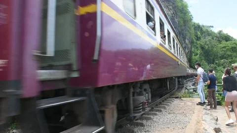 Train run on track at hellfire pass mountain station in Kanchanaburi, Thailand Stock Footage 156589456