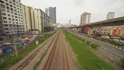 Train running at Bangsar with urban city scene Stock Footage 107075806