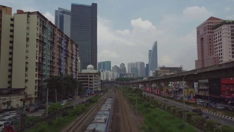 Train running at Bangsar with urban city scene Stock Footage 107075857