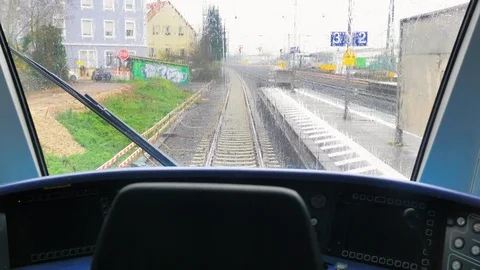 Train running from the driver's cabin on a rainy day Stock Footage 124473151