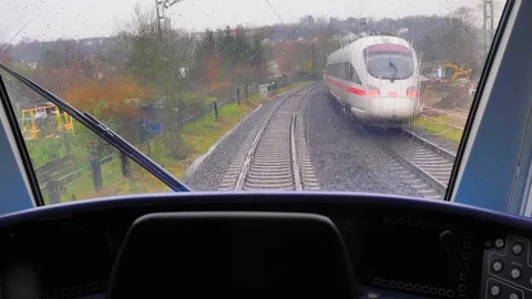 Train running from the driver's cabin on a rainy day Stock Footage 124484576