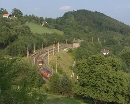Train running up a mountain near Klamm, Semmering Railway ,Austria Stock Footage 33531660