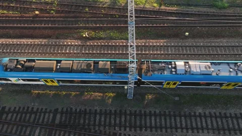A train running on rails. Concept of train traffic, rail transport, passenger Stock Footage 197578860