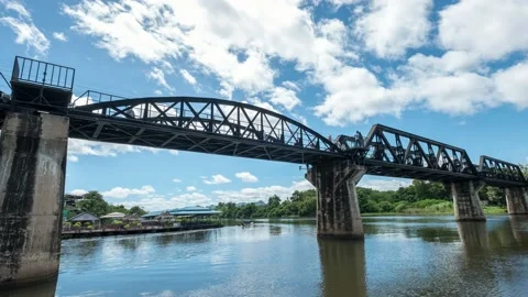 Train running on River Kwai bridge with railway station Stock Footage 196816765