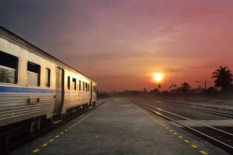 Train running in sunset Stock Photos