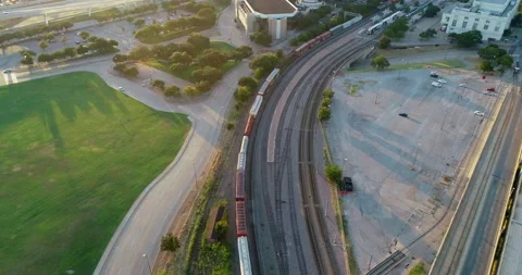 Train running through Dallas at sunset Stock Footage 150186463
