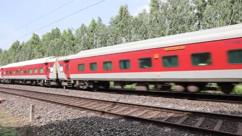 Train running through rural area Stock Footage 301210940