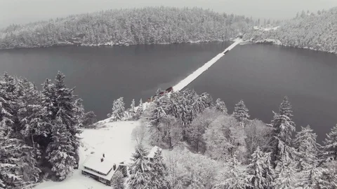 Train running through snow covered mountains by the sea  Stock Footage 102807334