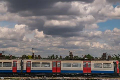 Train running on the train track With a backdrop of beautiful sky and clouds. Stock Photos