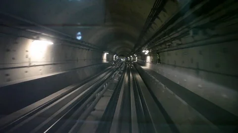 Train runs fast in underground subway tunnel of Dubai Stock Footage 71775349