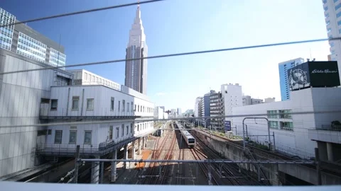 A train runs under the bridge in Tokyo Japan. Shinjuku. Stock Footage 220098326