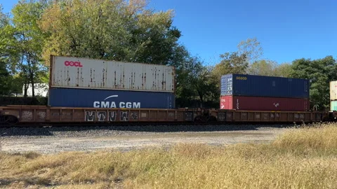 A train with shipping containers in autumn Stock Footage 326011609