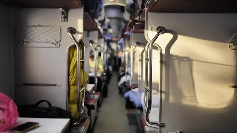 Train sleeper car interior with beds and aisle during a long journey Stock Footage 341700967