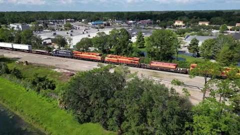 Train slow roll through suburbs 動画素材 247225663