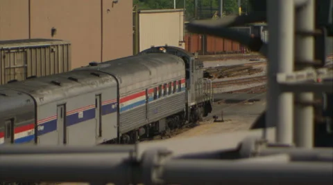 Train slowly moves thru Chicago railway yard (mute) Video stock 49846199