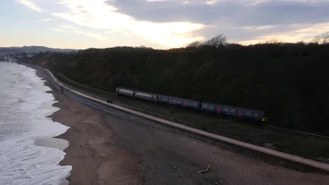 Train slowly passing by the ocean Stock Footage 73835504
