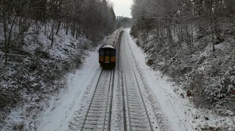 Train on snowy tracks 1 Stock Footage