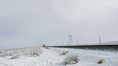 Train sounds whistle approaching with light snow falling Stock Footage 74776706