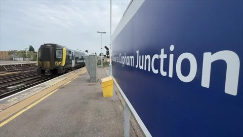 A train speeding through Clapham Junction station Stock Footage 241605877