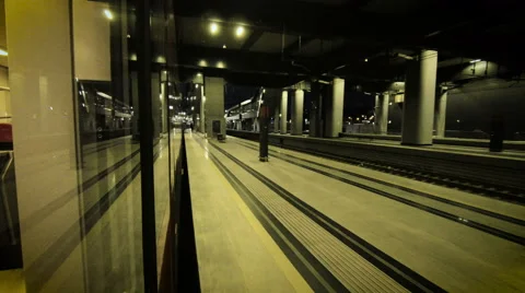 Train speeding through night station Stock Footage 58072763