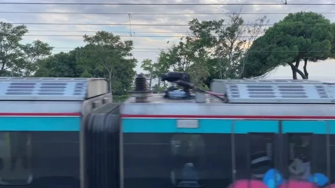 A train speeding through the railway track in cloudy evening Video stock 160768522