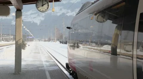 Train stand on railway station at winter day in village Stock Footage