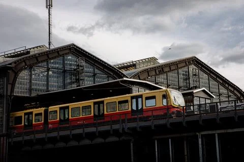 The train stands on the platform of the old retro railway station. Stock Photos