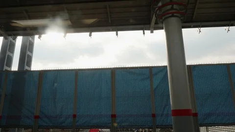 Train starts moving from station under construction. View from window of moving Stock Footage 109574562