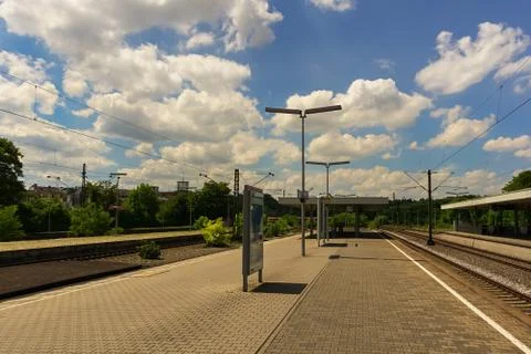 A train station below a cloudy summer sky Stock-Fotos