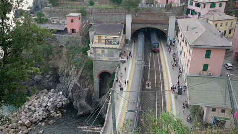 Train Station in Cinque Terre, Train entering station Stock Footage 158523034