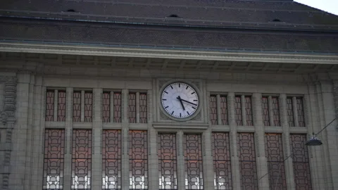 Train station clock up the building Stock Footage 168982559