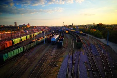 On train station during dramatic sunset backdrop Stock Photos