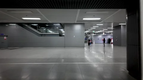 Train station entrance with automatic glass doors and platform signage Stock Footage 320675741