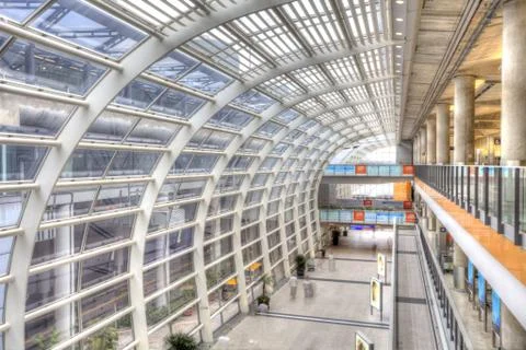 Train station with moving passengers Stock Photos