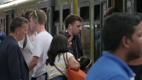 Train station. Passengers getting on and off the train. Stock Footage 76365655